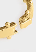 Close-up of Milos Hinged Bangle Gold – hammered texture and hinged clasp detail