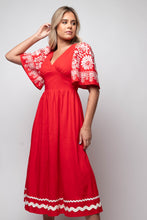 red midi dress with embroidered sleeves