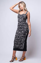 fitted black midi dress with abstract pattern