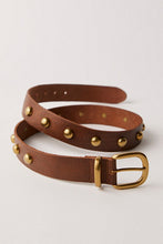 Cognac leather belt with rounded brass buckle and stud accents