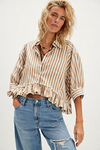 Textured tan and cream stripe button-up with dropped shoulders and a gathered ruffle hem