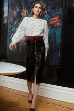 Model wearing black faux leather Taren Skirt by ALLISON New York