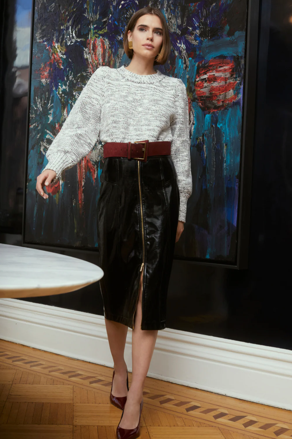Model wearing black faux leather Taren Skirt by ALLISON New York
