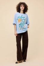 Oversized vintage-style tee with Johnny Cash print and sun graphic by Daydreamer LA