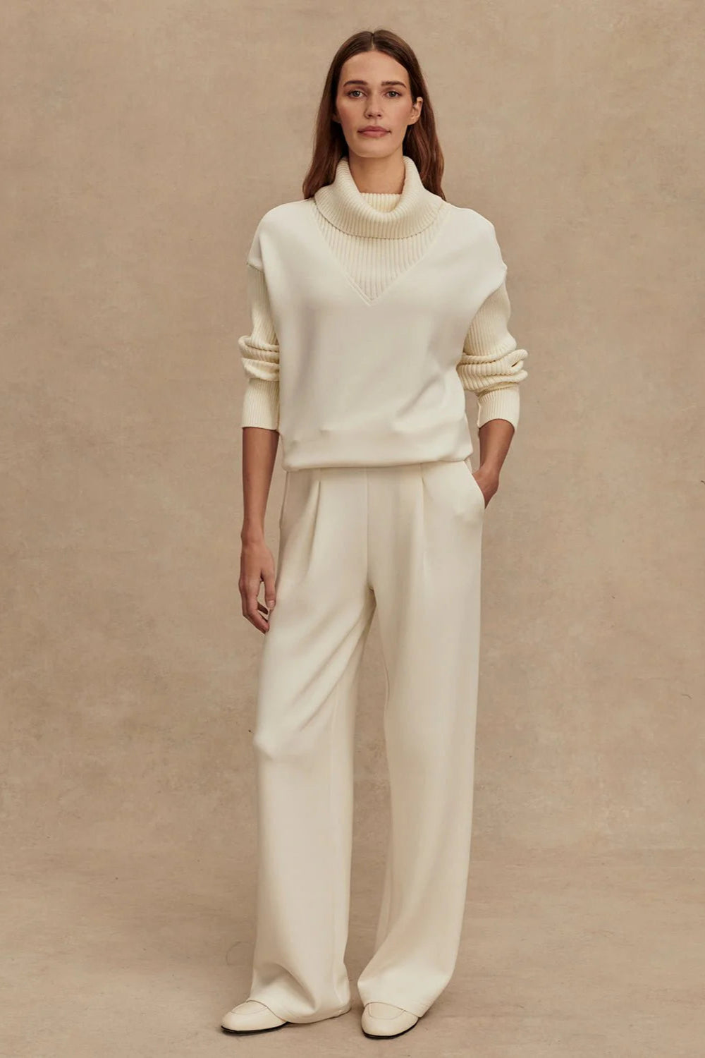 Model wearing the Varley Wide Leg Pant in the color Egret