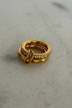 The Grace Ring in gold with pavé crystal detail styled on hand with watch and bracelets