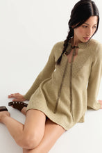 Free People Bali Old Flame sweater mini dress in Olive Tree Heather, seated model view