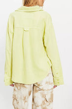 Back view of Free People linen button-down top with long sleeves