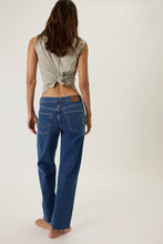 Mid rise straight jeans with paneled detailing and lightly distressed edges