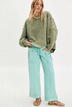 green Free People ribbed knit tee with a relaxed fit and worn-in feel