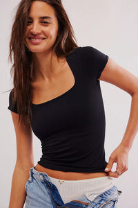 Clean Lines Baby Tee by Free People in a fitted black silhouette with short sleeves