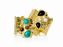 Easton Elle Ultra Haven Cuff with multicolored cabochon stones, angled view on white.