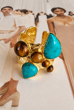 Easton Elle Ultra Haven Ring, gold with turquoise and tiger’s eye cabochons, angled view.