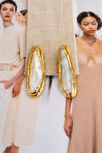 Easton Elle Linear Pearl Studs, enhanced product photograph on fashion magazine