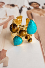 Easton Elle Ultra Haven Ring, turquoise and tiger’s eye on hammered gold, magazine close-up.