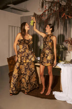 Model wearing the Irisa Shift Mini Dress in Brown & Gold Floral to girls lunch