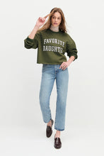 Model wearing the smoketree gardenia sweatshirt with 'Favorite Daughter' text