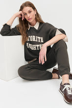 Model wearing the coffee gardenia collegiate sweatshirt  