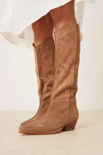 Free People Sway Low Slouch Boots 2.0 in Tan suede, styled on legs showing the tall shaft and low heel.