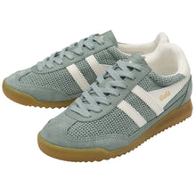 Pair of light green sneakers with white stripes showing off Gola Brand