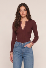 Heartloom Pine Top in Mahogany, model view showing the fitted long sleeves and button neckline.