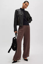 Model wearing the Free People Kenzie Tee in black