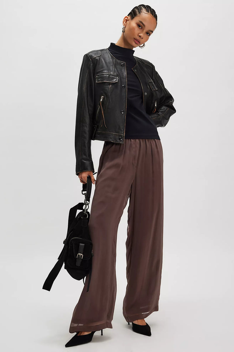 Model wearing the Free People Kenzie Tee in black