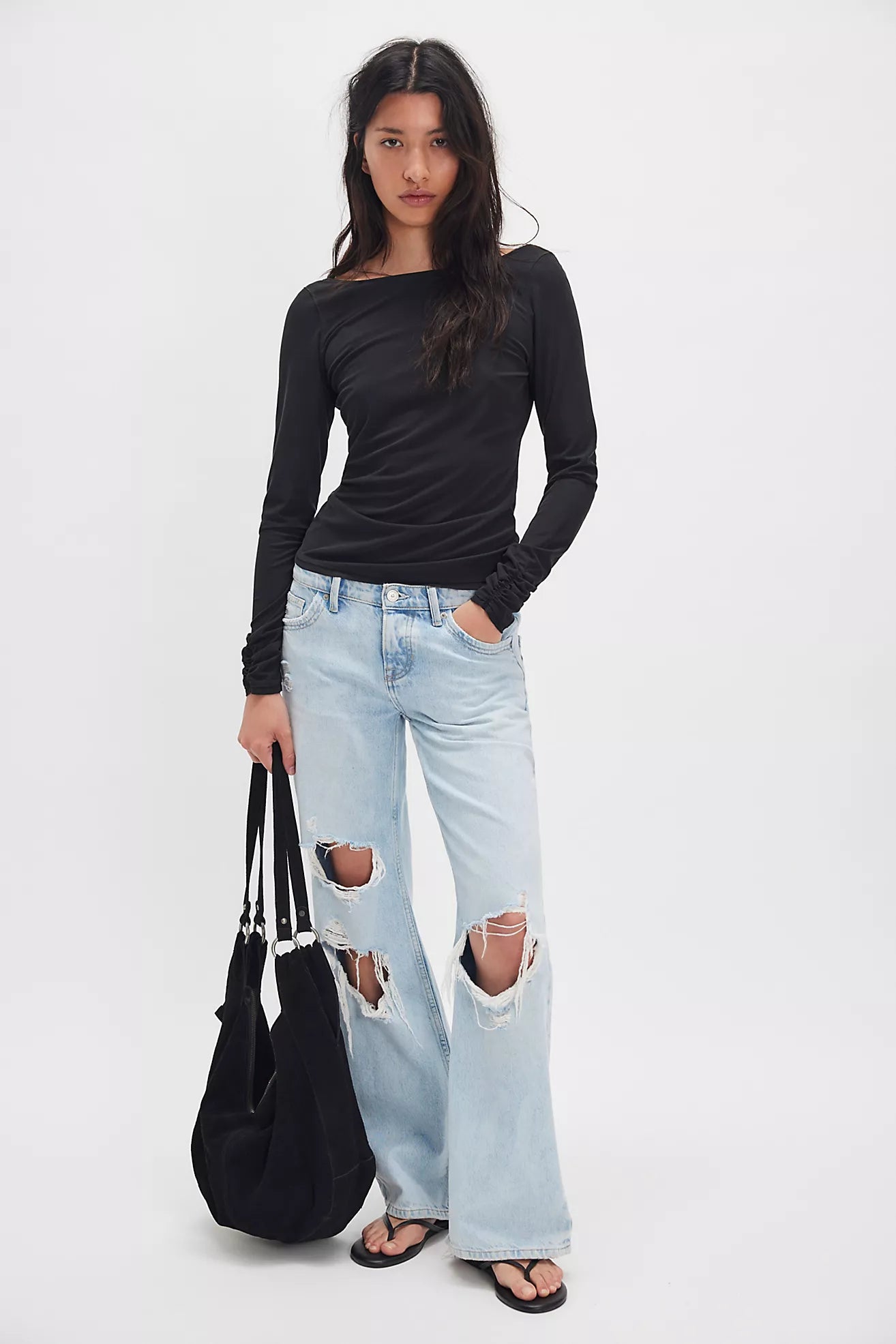 Model is wearing the Riley Tee in black