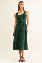 Angled front view of Kensley hunter green midi dress with contrast piping