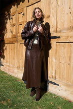 Moon River Chocolate faux-leather midi skirt, side view with handkerchief hem