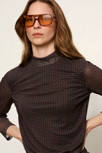 Sanctuary 3/4 Sleeve Mesh Mock Neck Top in Espresso Geo, close-up of the geometric mesh and mock neckline.