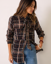 Sanctuary Meet in Paris Tie Neck Blouse in Cinder plaid, close-up of the neck tie, chest pockets and rolled sleeves.