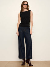 Sanctuary Scoop Back Tank in Black, full-length model view styled with dark cropped jeans.
