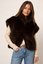 Sanctuary Silky Fur Vest in Espresso Martini, dark brown plush vest layered over a cream lace top.