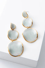 Stacked sphere drop earrings by Noonday Collection with porcelain discs and gold luster
